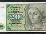 le recto d'un billet de banque sur lequel figure le visage d'une femme