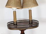 two lamps that are on a table with a basket on it