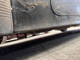 a close up view of a dirty car ' s rear end