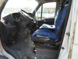 a picture of the inside of a truck with the driver ' s seat up