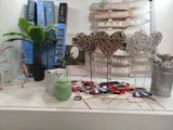 a white table topped with books and a vase