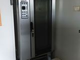 a metal door that is open in a room