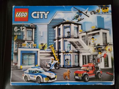 a box with a lego city set in it