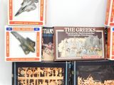 many different types of toys in the box on the table