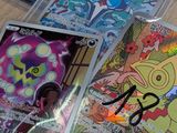 a lot of pokemon cards on the table