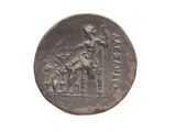 an old coin with a man on a horse and a dog on it