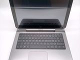 a laptop computer sitting on top of a white table
