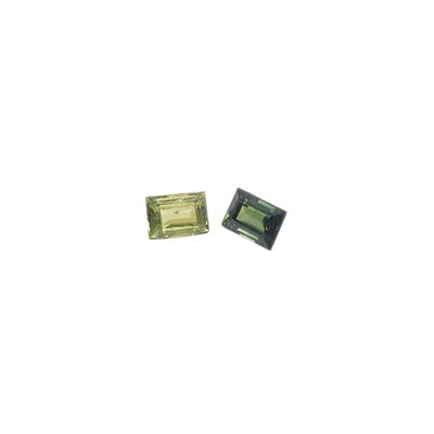 a pair of green tourmaline gems on a white background
