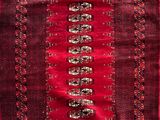 a close up of a red rug on a white background
