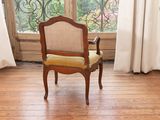 a chair that is sitting in front of a window