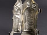 an image of a silver sculpture of a woman and a man