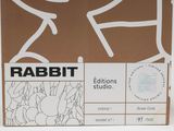a cardboard box with a drawing of a rabbit on it