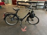 a bicycle that is parked in a garage