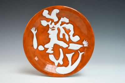 a plate with a picture of a man and a woman on it