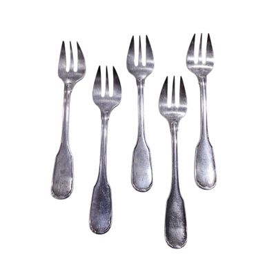 four forks and spoons are arranged in a row on a white surface