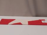 an image of a red and white rug with a star on it