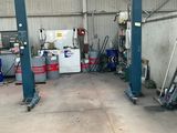 a picture of a garage with a lot of tools on the floor