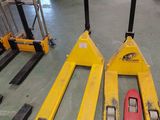 many different types of forklifts in a warehouse