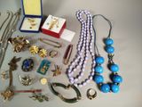 a lot of jewelry that is laying out on the table