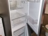an open refrigerator in a kitchen with no door