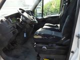 a white van with a black seat in the back of it
