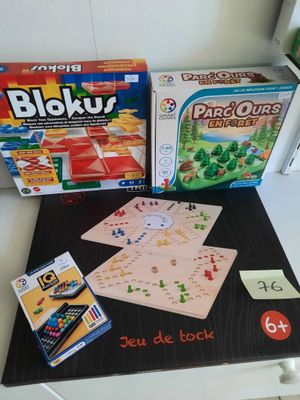 two board games on the table and one has a card game on it