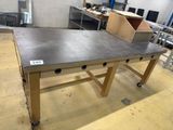 a table with a metal top in a large room