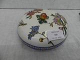 a white box with flowers on it on a table