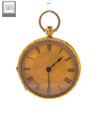 a gold pocket watch with roman numerals on the face