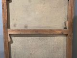 an old wooden frame holds a painting on a white background