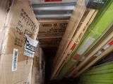 many boxes stacked on top of each other in a room