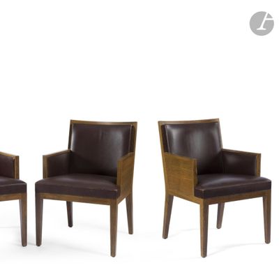three brown leather chairs with wooden legs and arms on a white background
