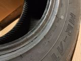 a close up of a tire on a box with a box in the background
