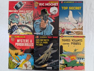un grand nombre de bandes dessinées sur la table