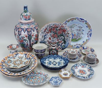 many different types of plates and bowls on the table