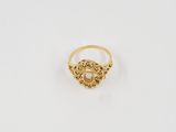 an image of a gold ring with a heart on it