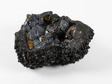 a close up of a piece of coal on a white surface
