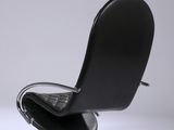 a black chair that is sitting on top of a table