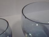 two empty wine glasses sitting on a table