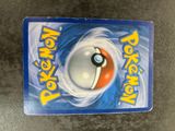 a close up of a pokemon card on a table