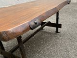 a wooden table with metal legs and a wooden table top