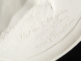 a white plate with a picture of a bird on it