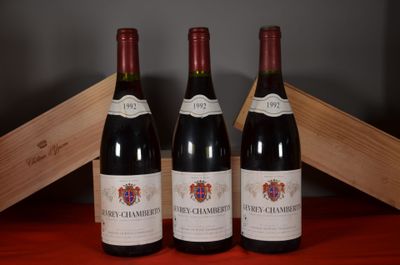 three bottles of wine sitting next to each other on a table