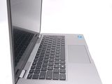 a silver laptop computer sitting on top of a white table