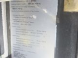 a close up of a pay phone with a sign on it