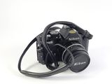 a black camera with a strap attached to it
