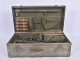 an old suitcase with a bunch of items inside of it