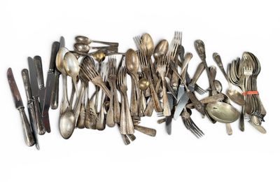 a lot of spoons and forks on the table