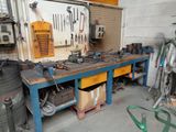 a workbench with tools on it in a garage