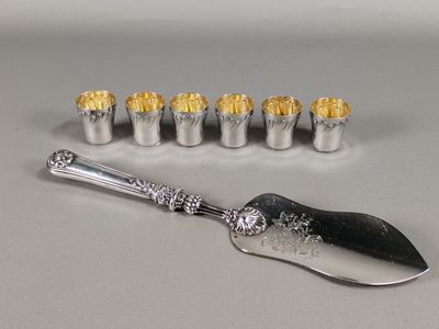 a silver spoon with a silver handle and a silver spoon with a silver handle